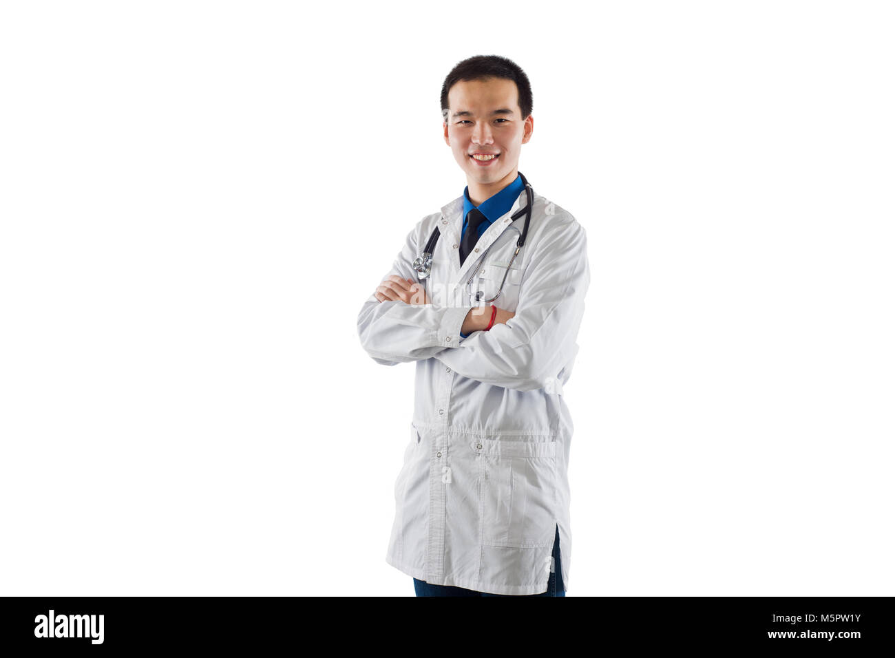 a young doctor, folded his hands, in a doctor`s overall Stock Photo